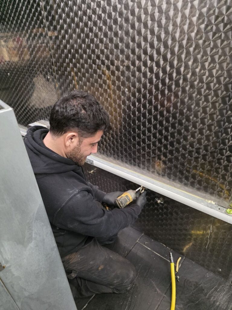 Gas Safe engineer installing commercial kitchen gas pipework