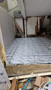 Subfloor insulation boards ready for underfloor heating installation
